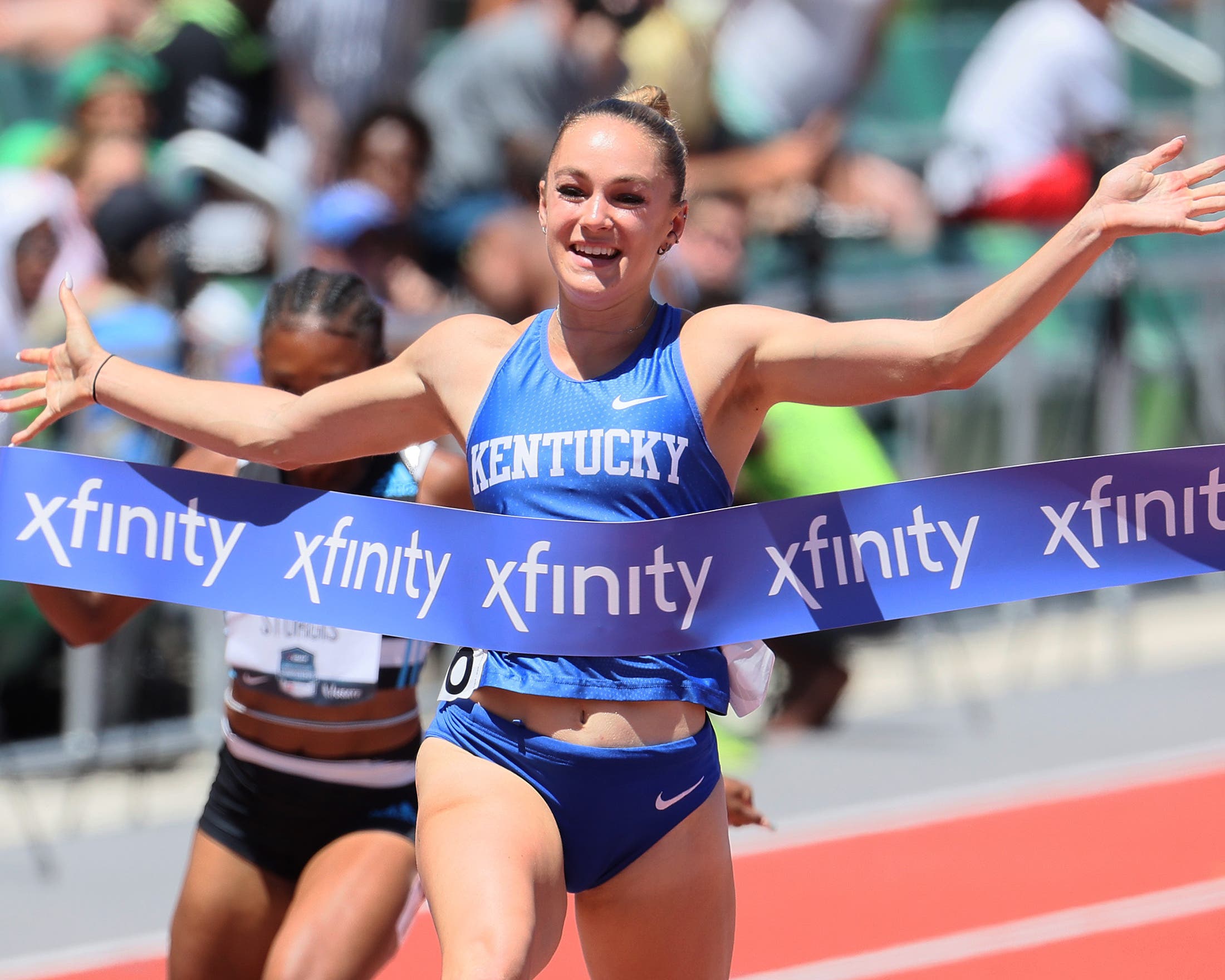 Abby Steiner breaking the tape at nationals