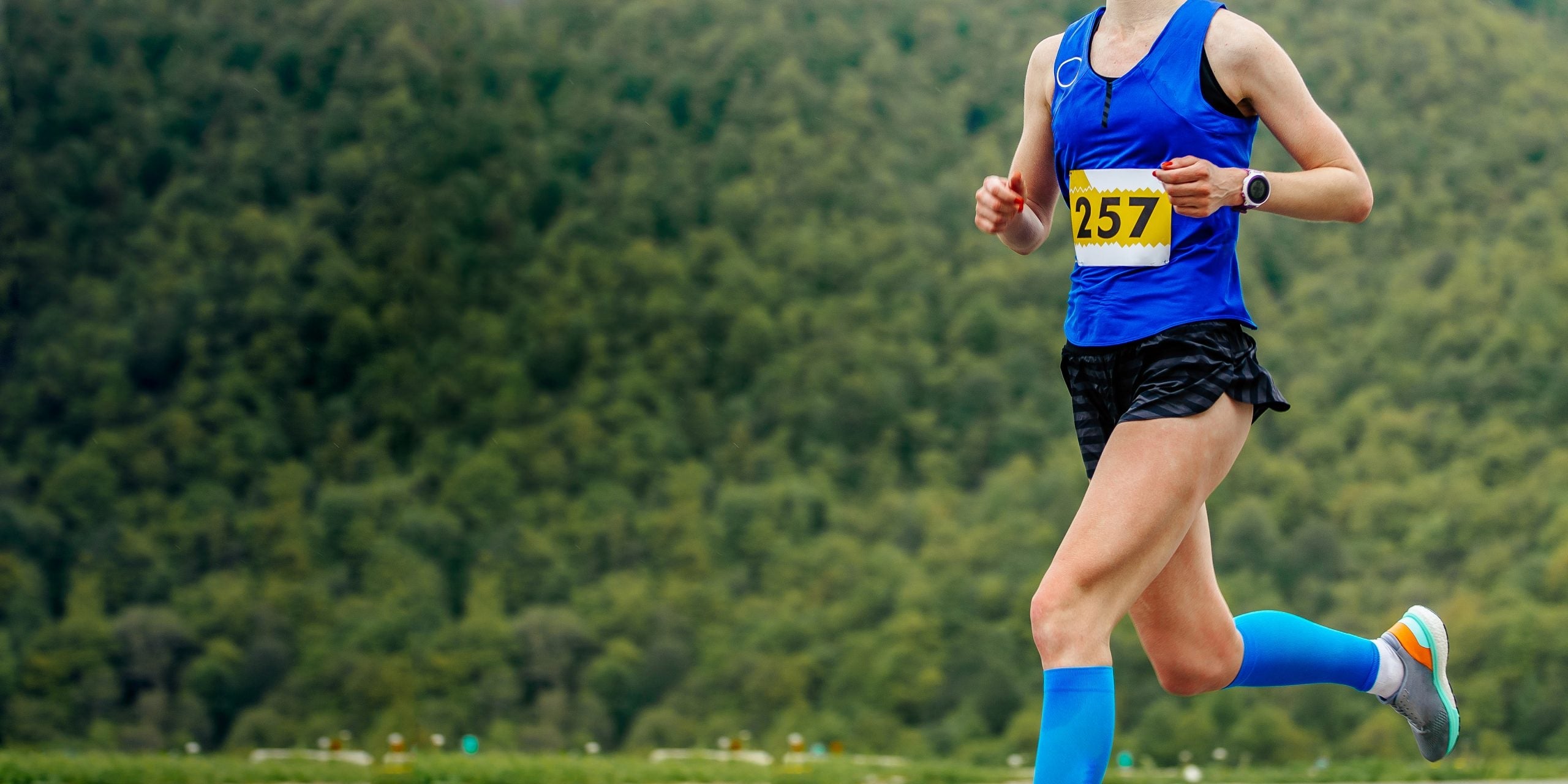 women runner running mountain marathon. concept of copy space