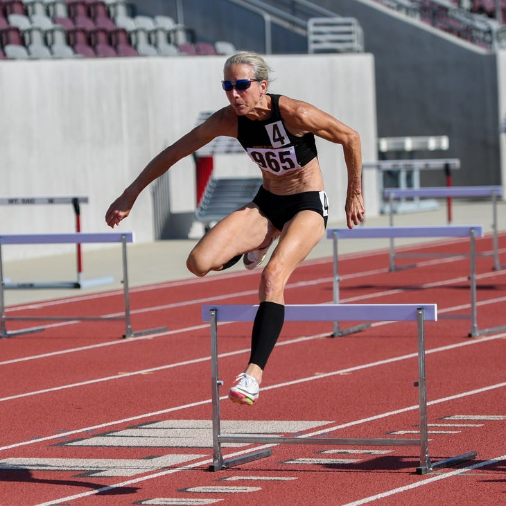 Sue McDonald jumping hurdles