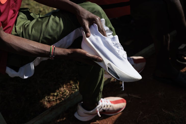 A runner holds the Nike Alphafly 3 in their hand.