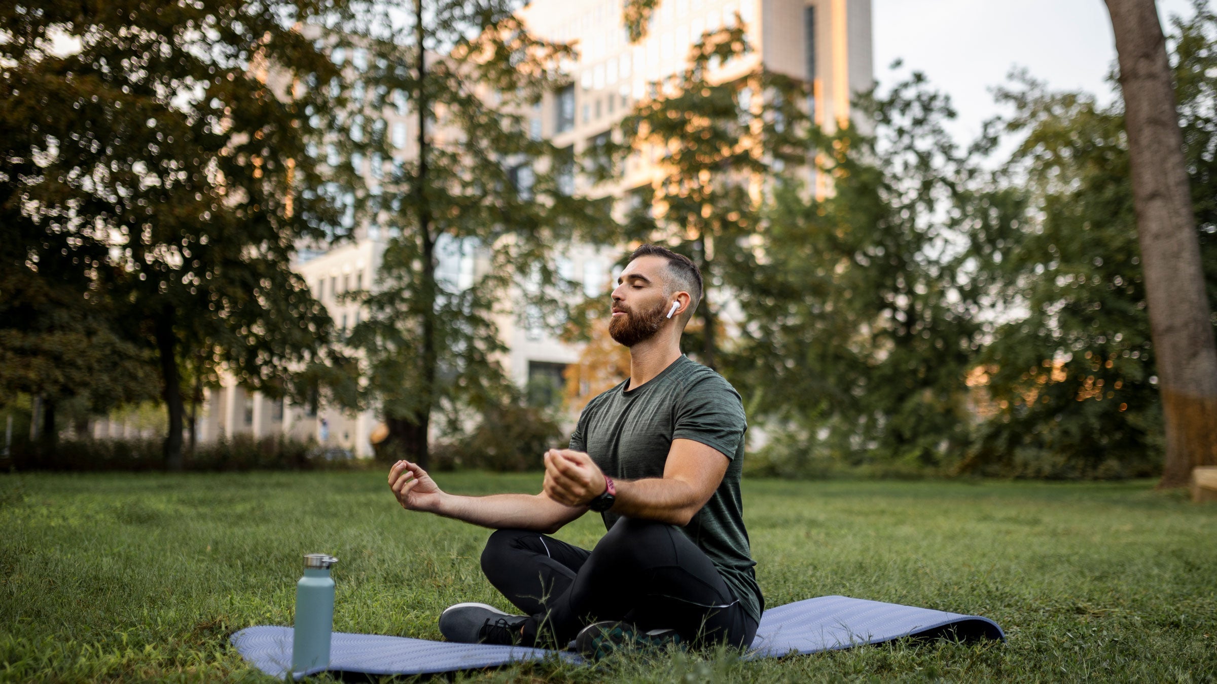 Man meditates outside